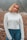 portrait photography of woman wearing white sweater and blue denim jeans