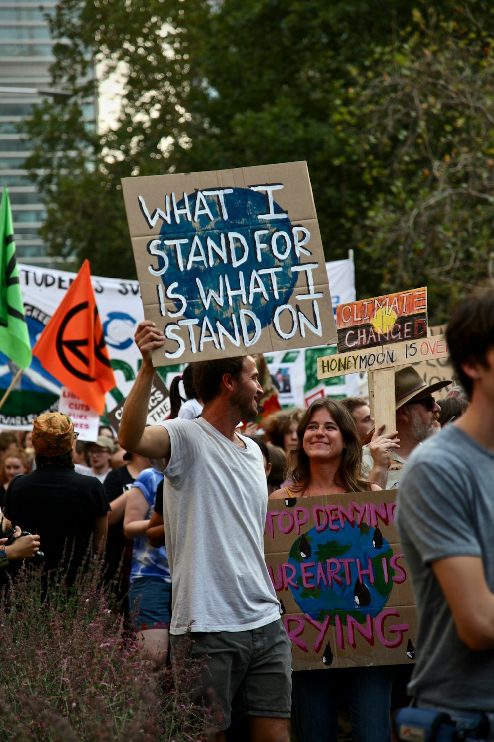 group of people holding signages