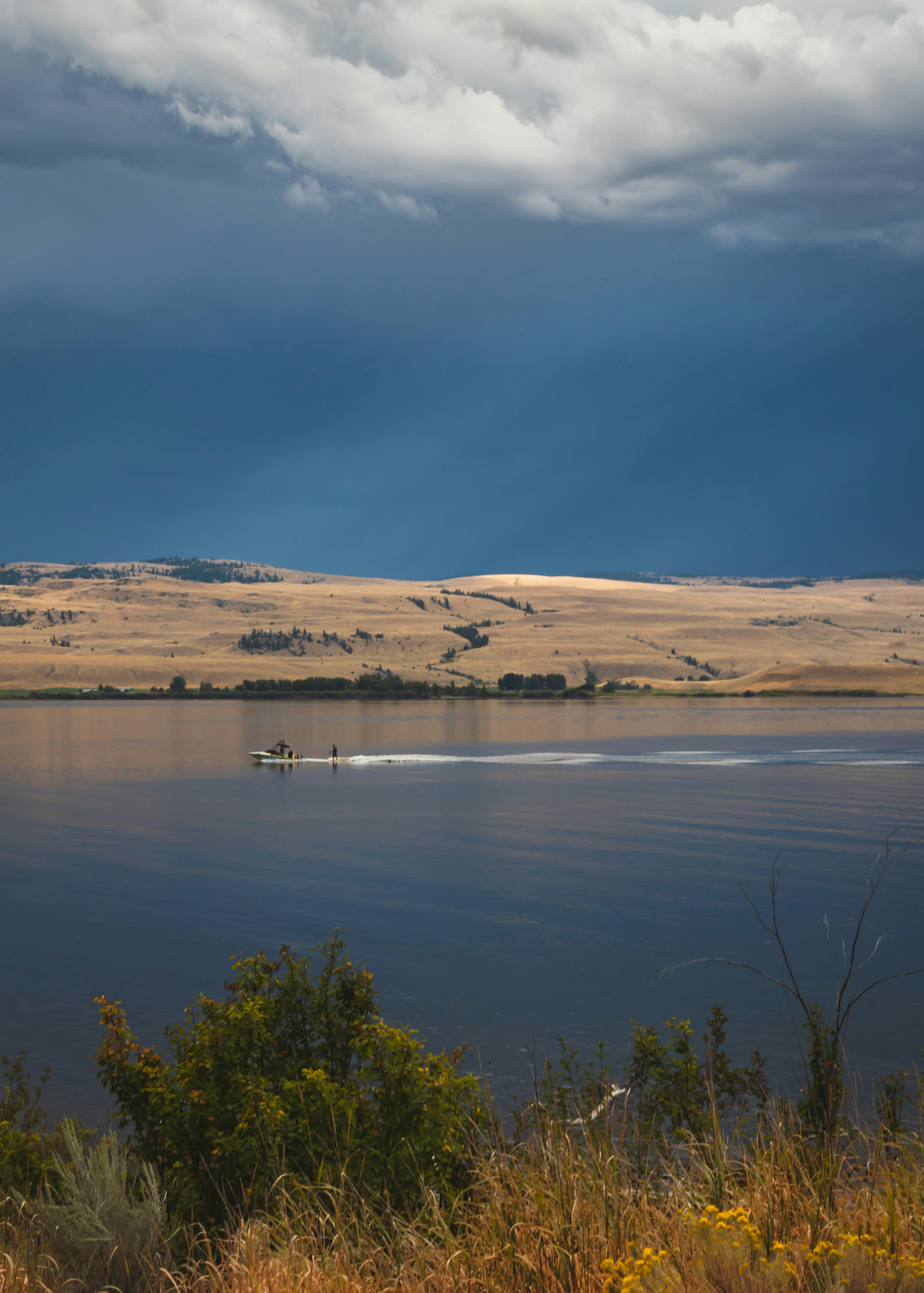 body of water under cloudy sky during daytime