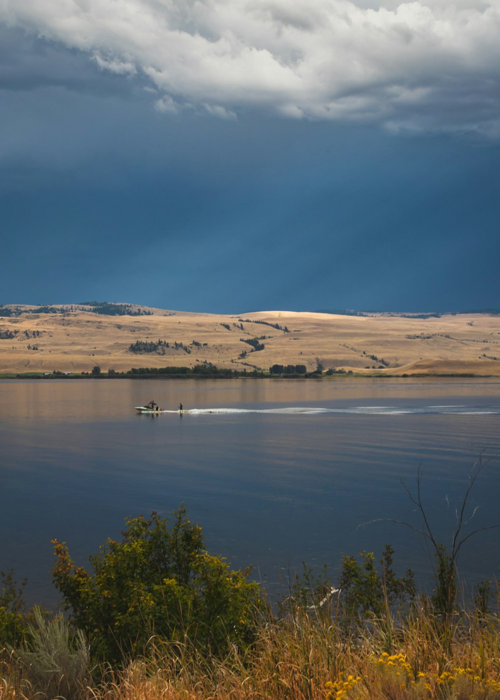 body of water under cloudy sky during daytime