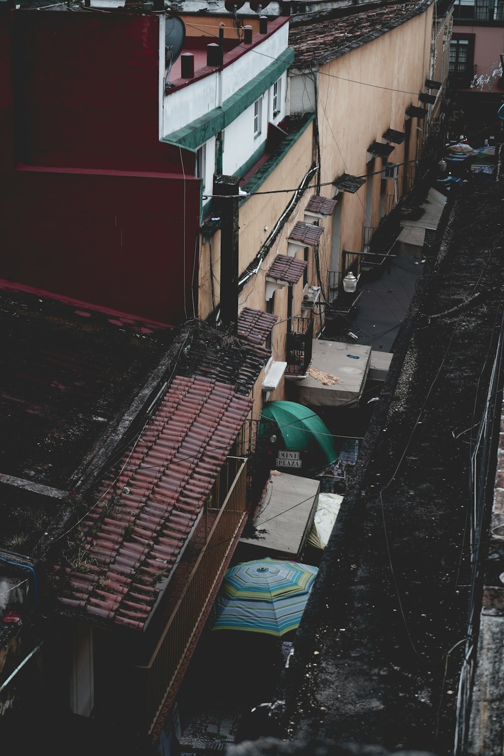 aerial photography of umbrellas beside wall