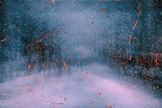 An abstract digital canvas showcasing swirling gradients from hot pink to sunny yellow with splatter textures.