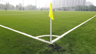 In-game action shot showing players battling near a flag on a custom-designed map.