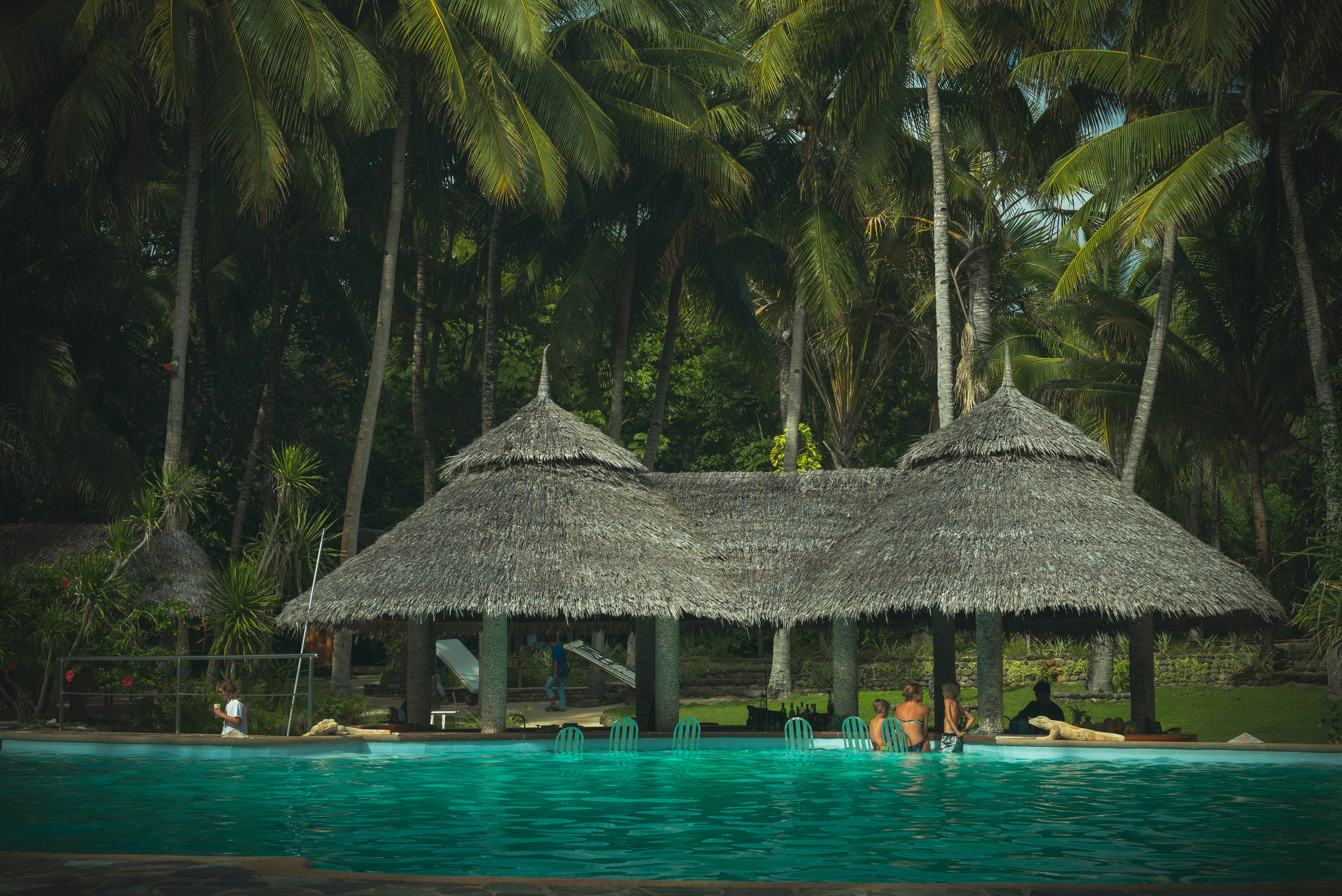 a couple of people that are in a pool