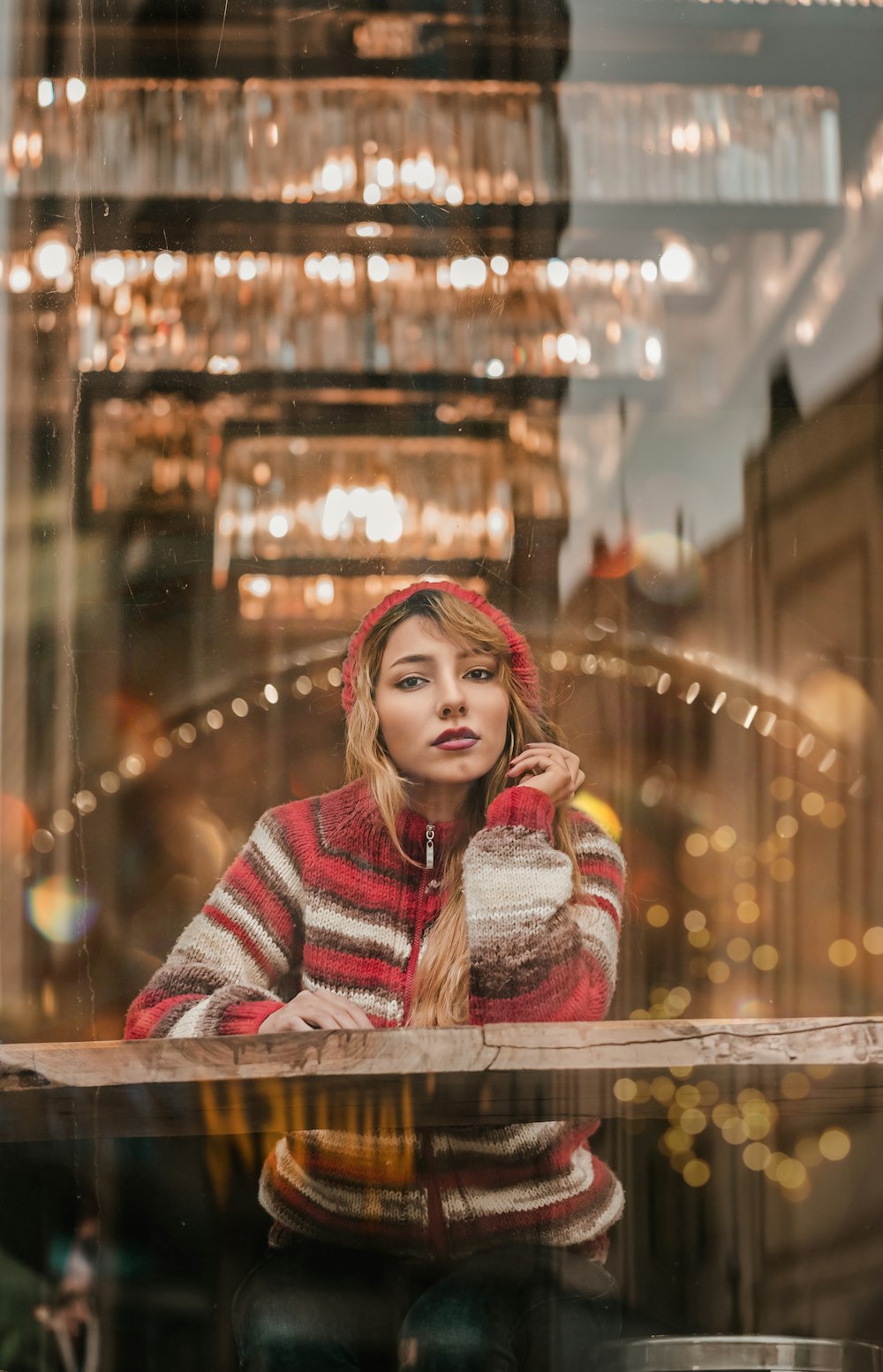 woman wearing red and white stripe zip-up hoodie