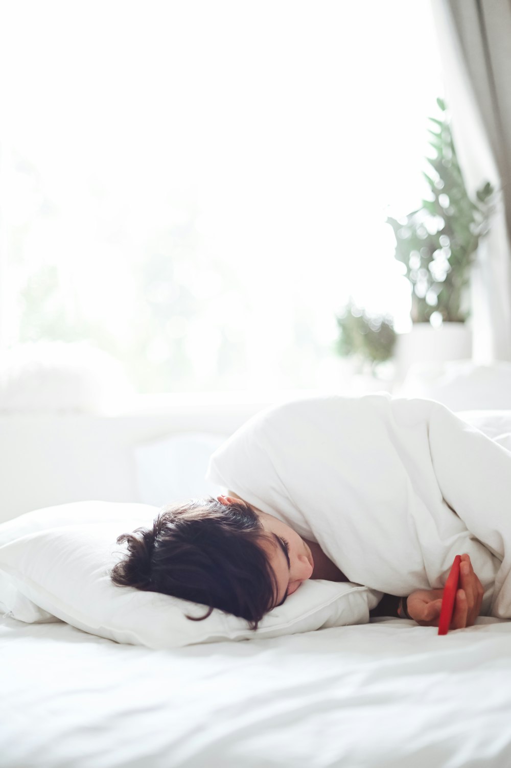 woman lying on bed