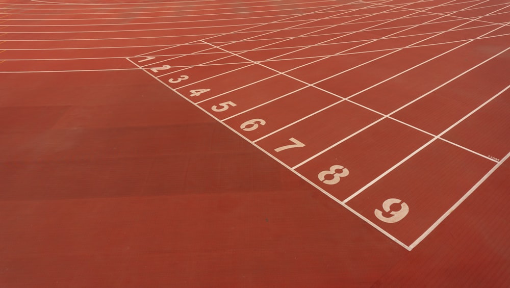 a red running track with numbers on it
