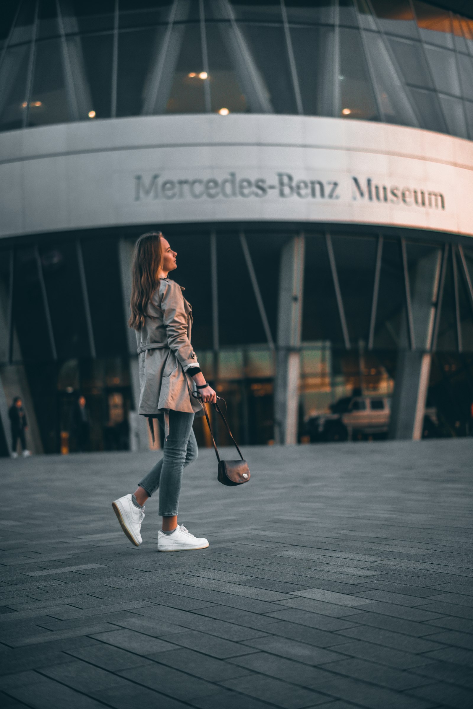 ZEISS Milvus 50mm F1.4 sample photo. Woman holding black leather photography