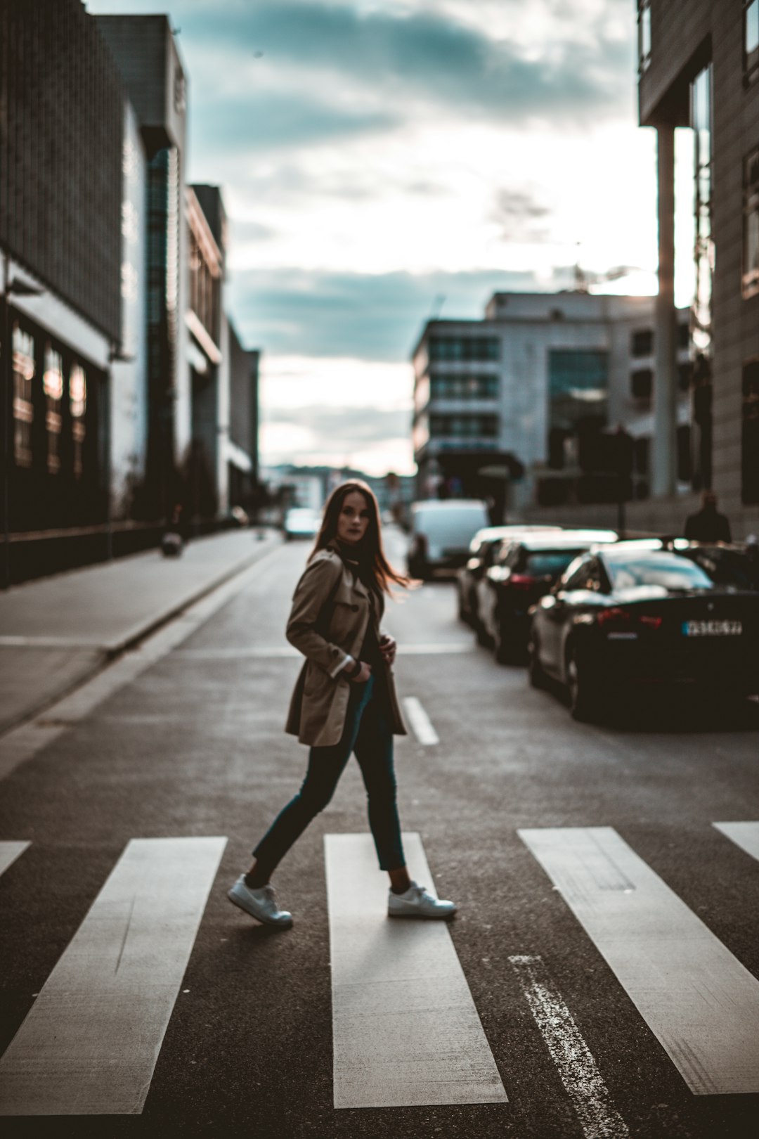 woman walking on pedestrian lane\