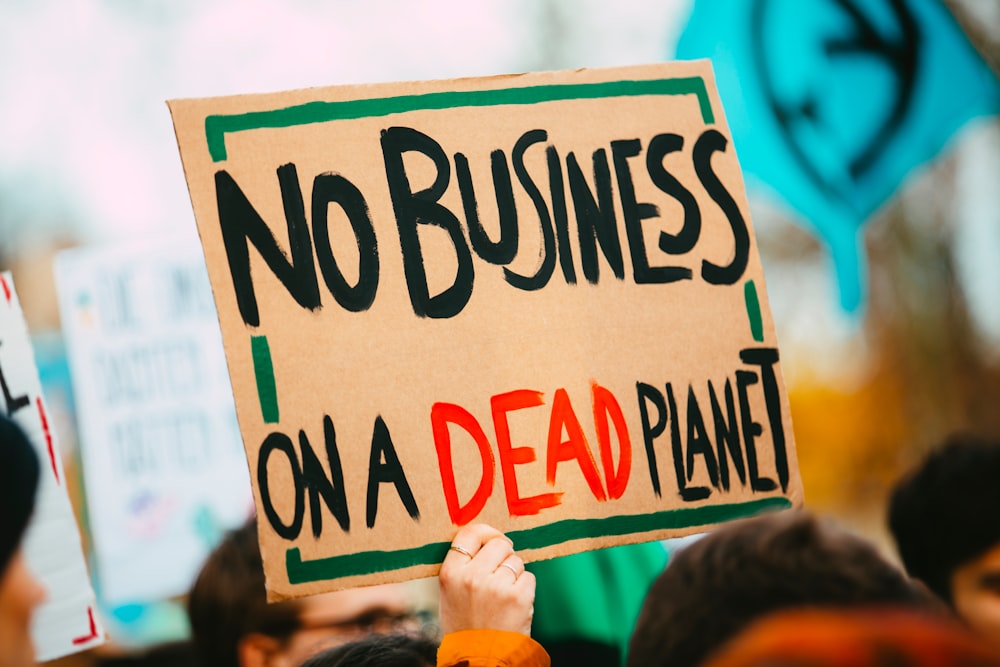 no business on a dead planet sign
