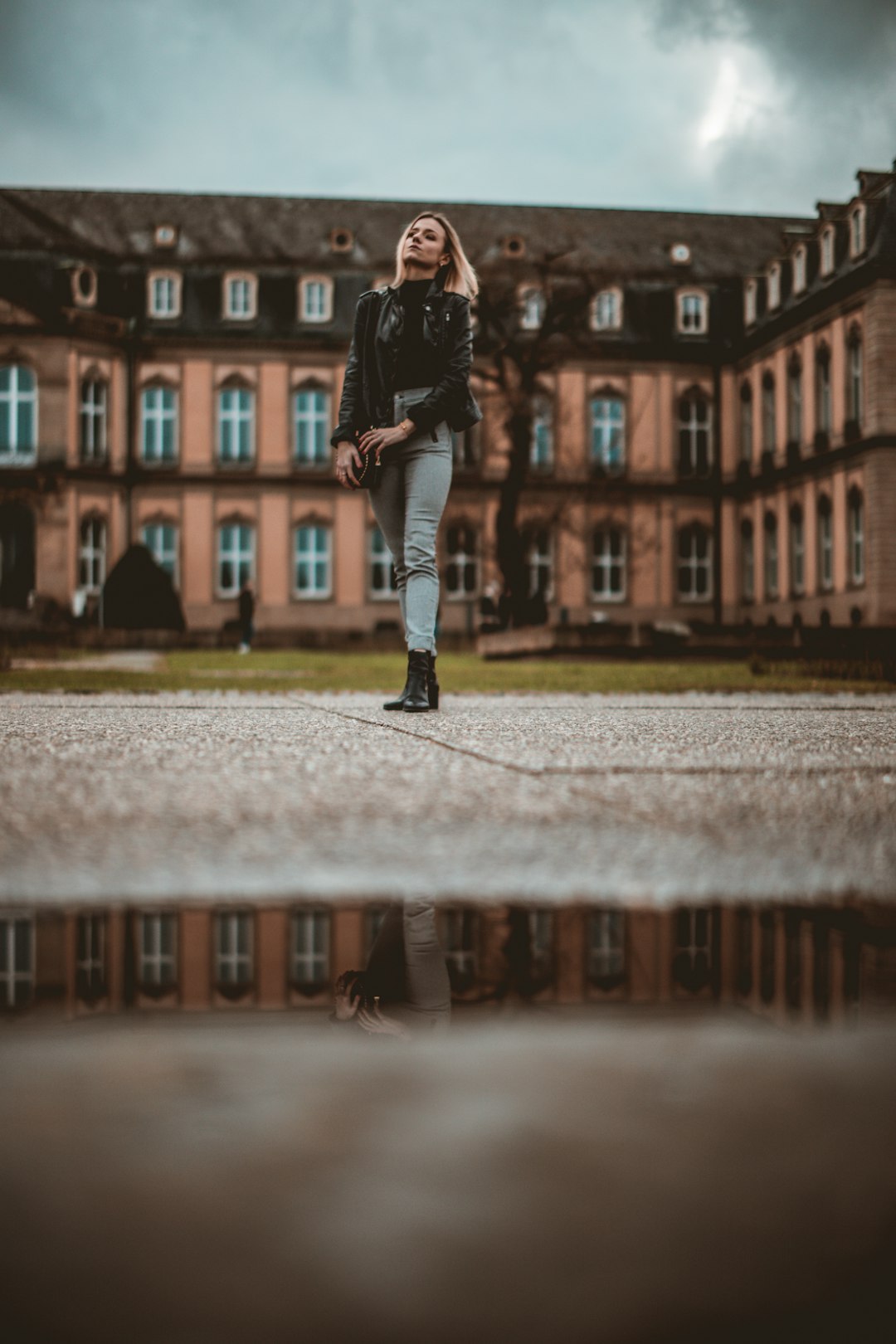 woman standing near 2-storey building