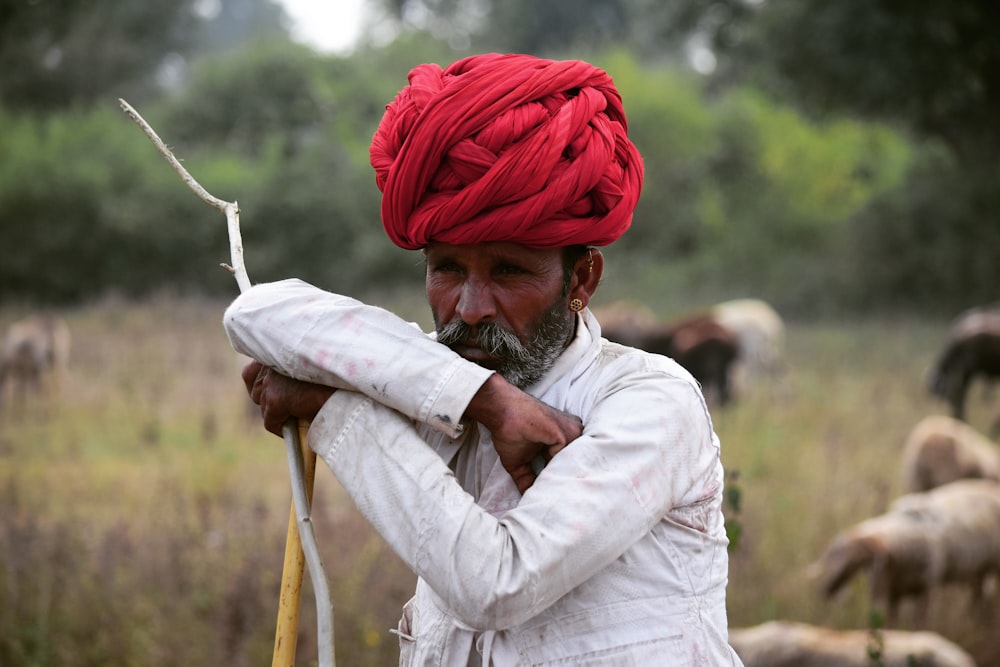 man wearing red headdress