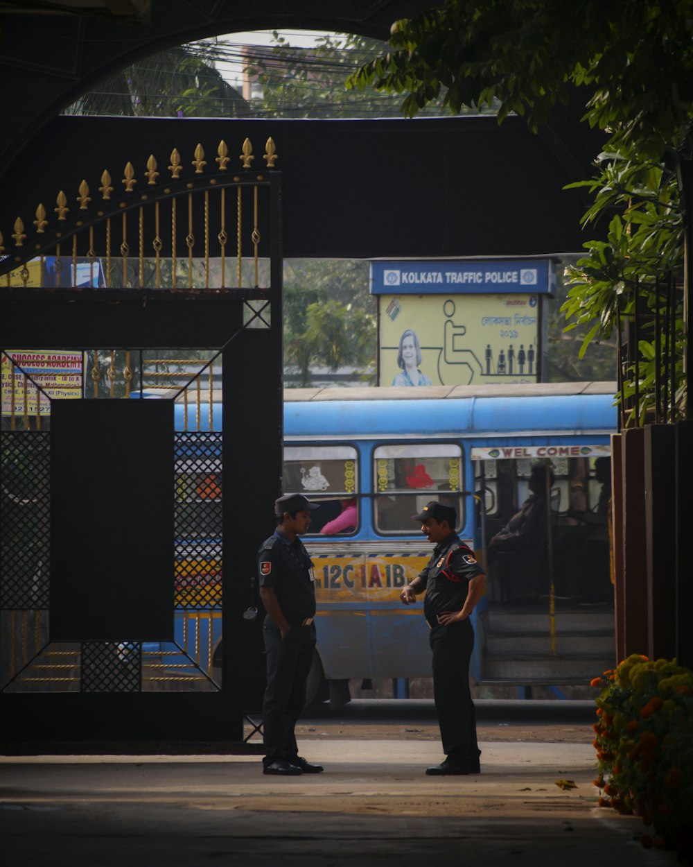 two police officers talking beside the cage