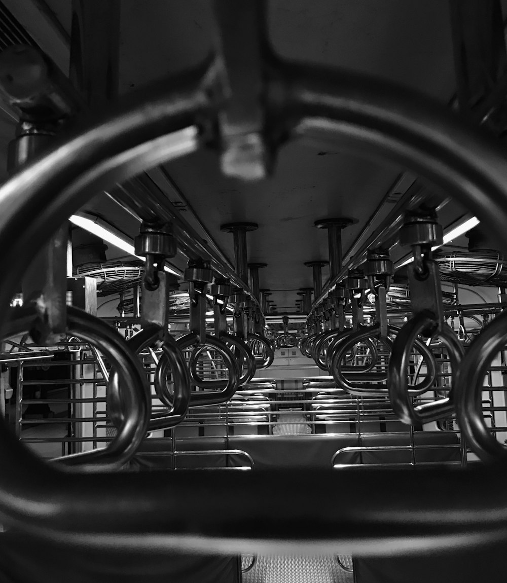 empty public transportation vehicle with hanging handles