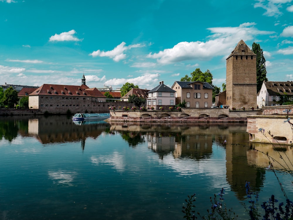 a body of water surrounded by buildings and trees