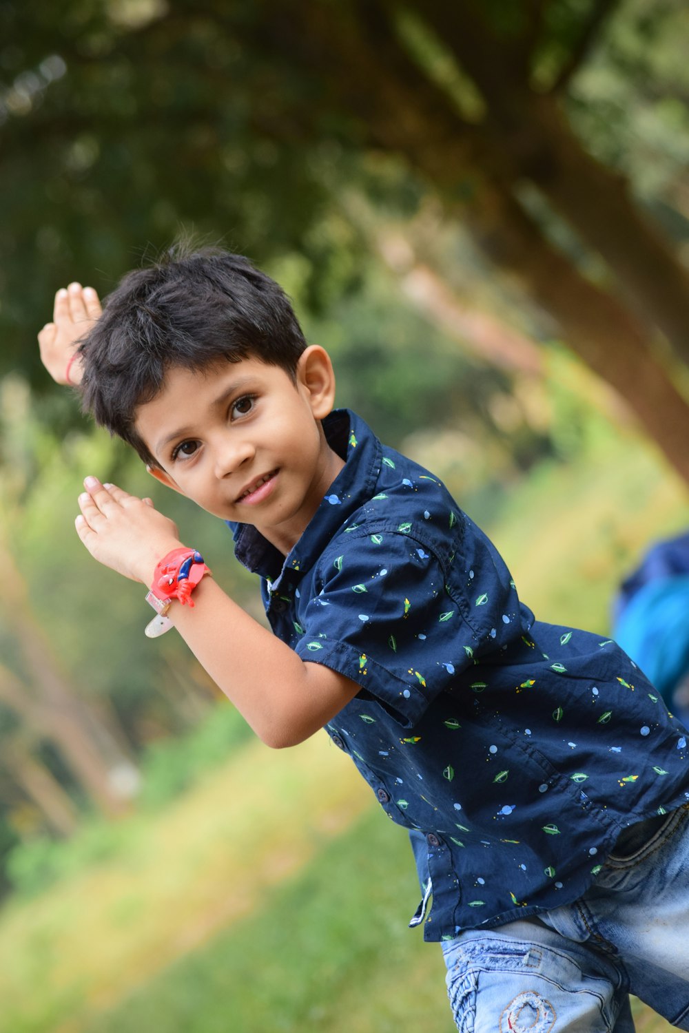 toddler raising both arms