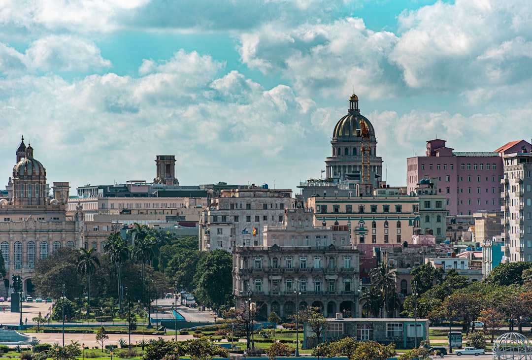 top view of buildings under cloudy sky,