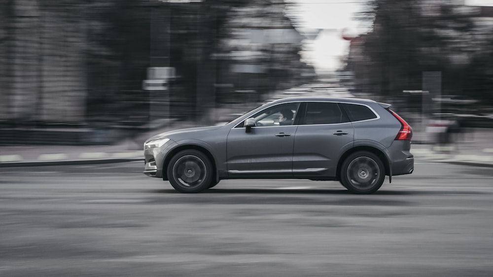 grey SUV running on the road