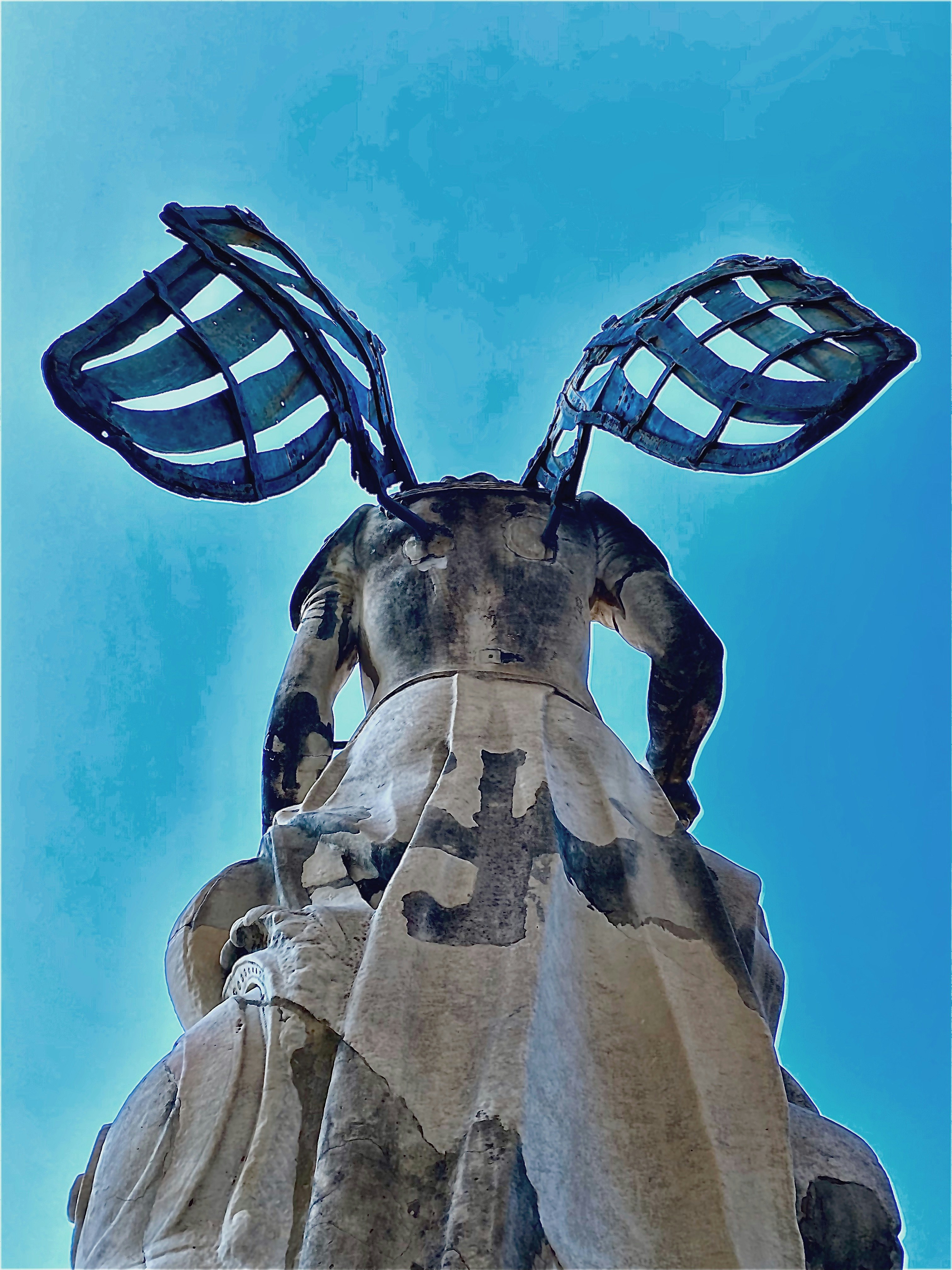 black and white striped soccer ball on statue