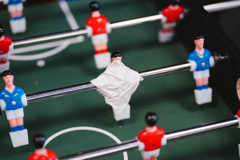 green, red, and blue foosball table