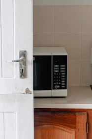 white and black microwave oven
