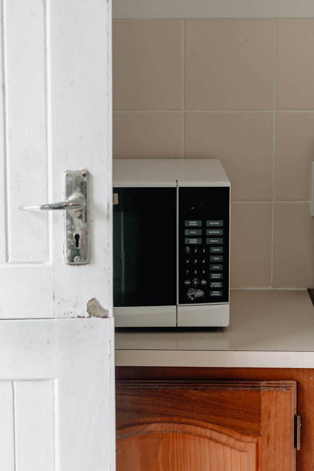 white and black microwave oven