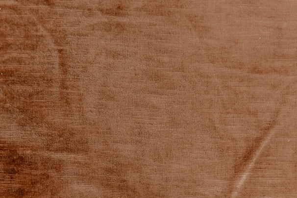 Close-up of sustainable materials with warm beige and terracotta tones.