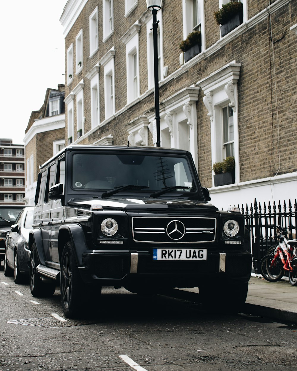 black Mercedes-Benz SUV parked beside road