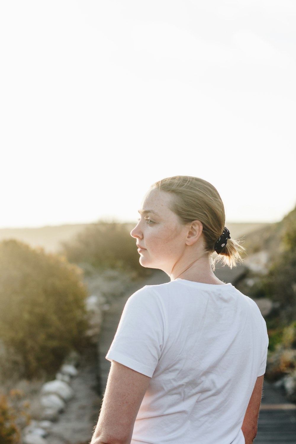 woman standing near trees