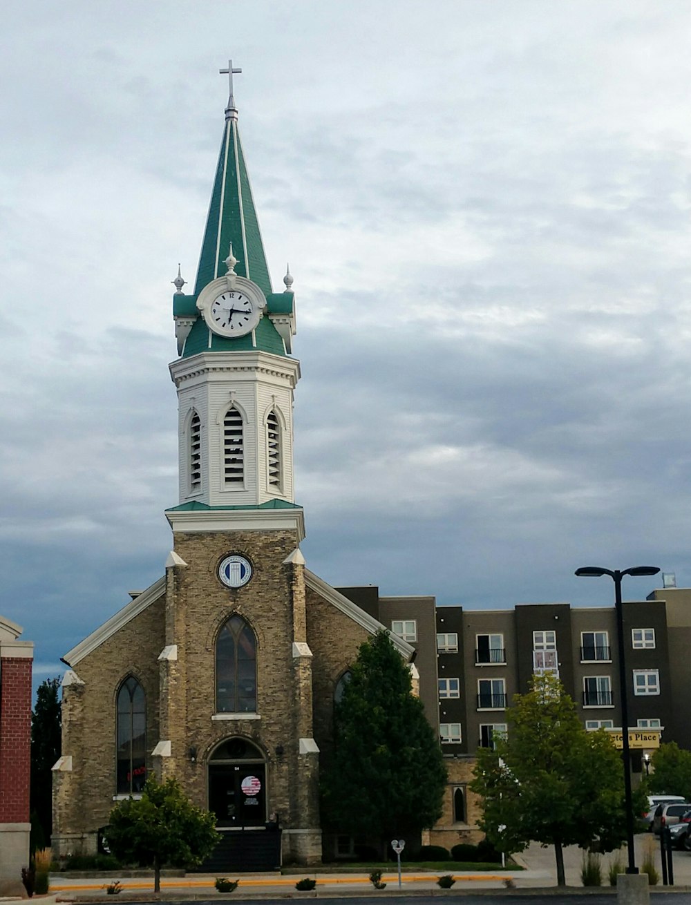 shallow focus photo of brown and white building under cloudy sky