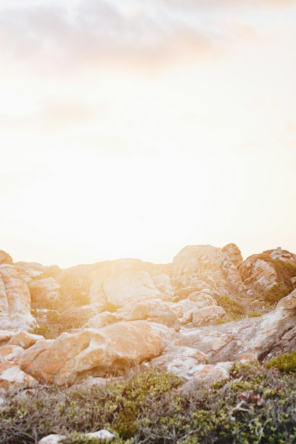 brown rock formations under white sky