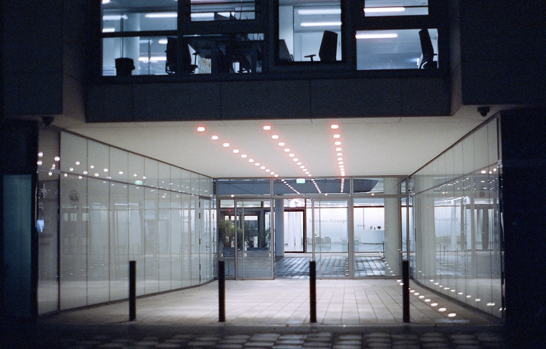 inside hallway of building with lighted ceiling light fixture