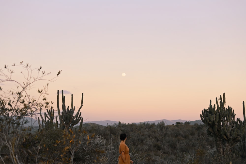 woman standing near trees