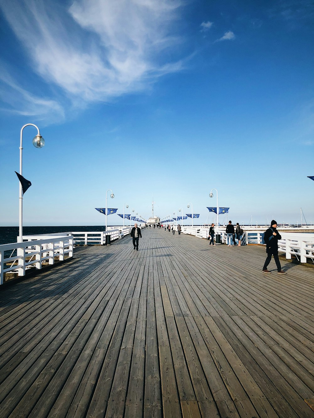 people walking on bridge