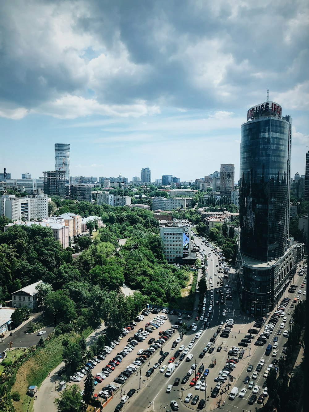 top view of cityscape under cloudy sky