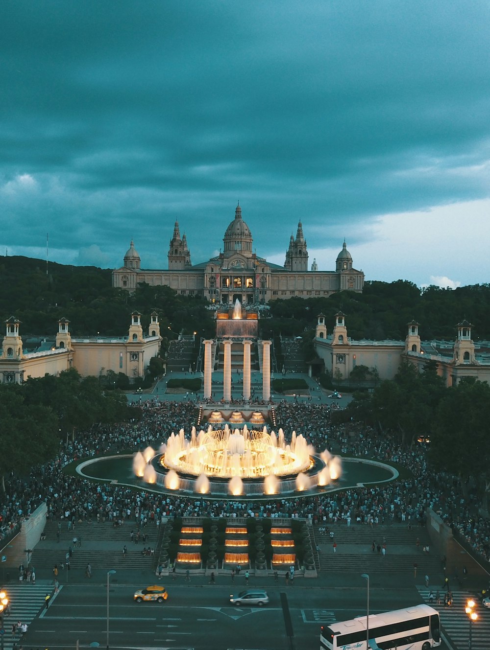 lighted water fountain in front of palace