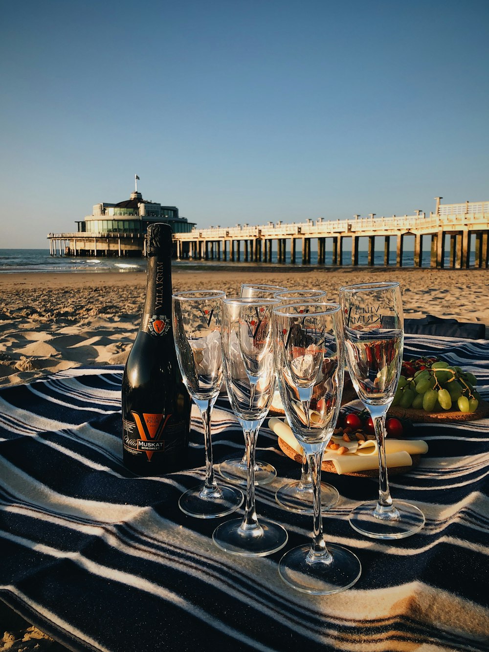 champagne glasses on table at beach