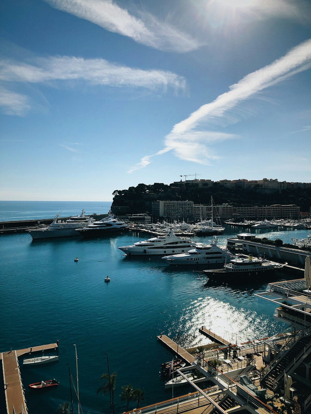 a harbor filled with lots of boats under a blue sky