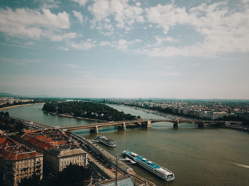 aerial photography of bridge connecting city skylines