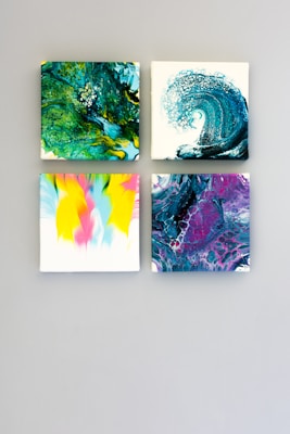 multicolored abstract 4-panel painting set on white surface