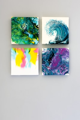 multicolored abstract 4-panel painting set on white surface