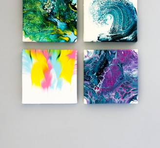 multicolored abstract 4-panel painting set on white surface