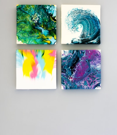 multicolored abstract 4-panel painting set on white surface