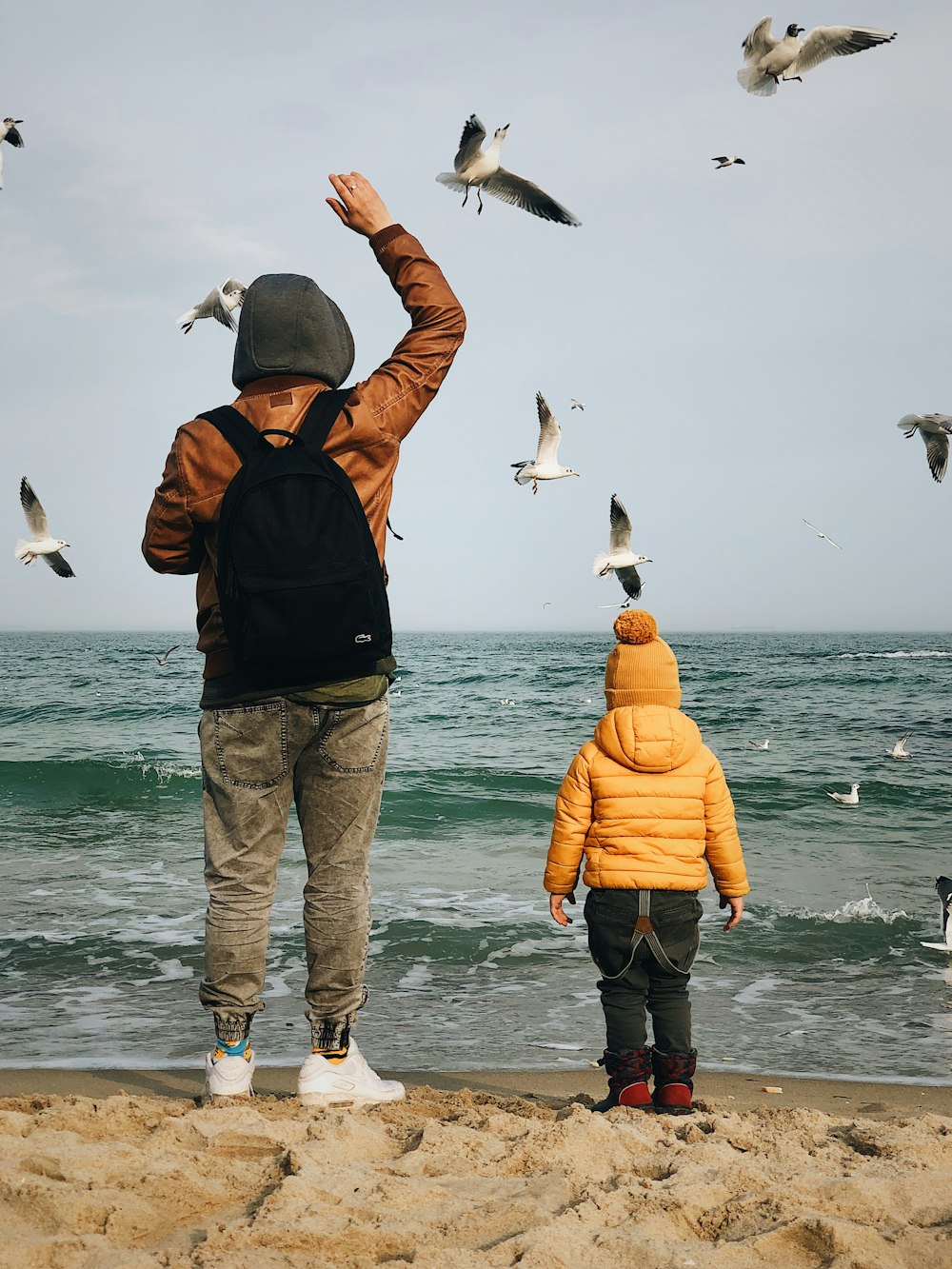 man and boy at beach