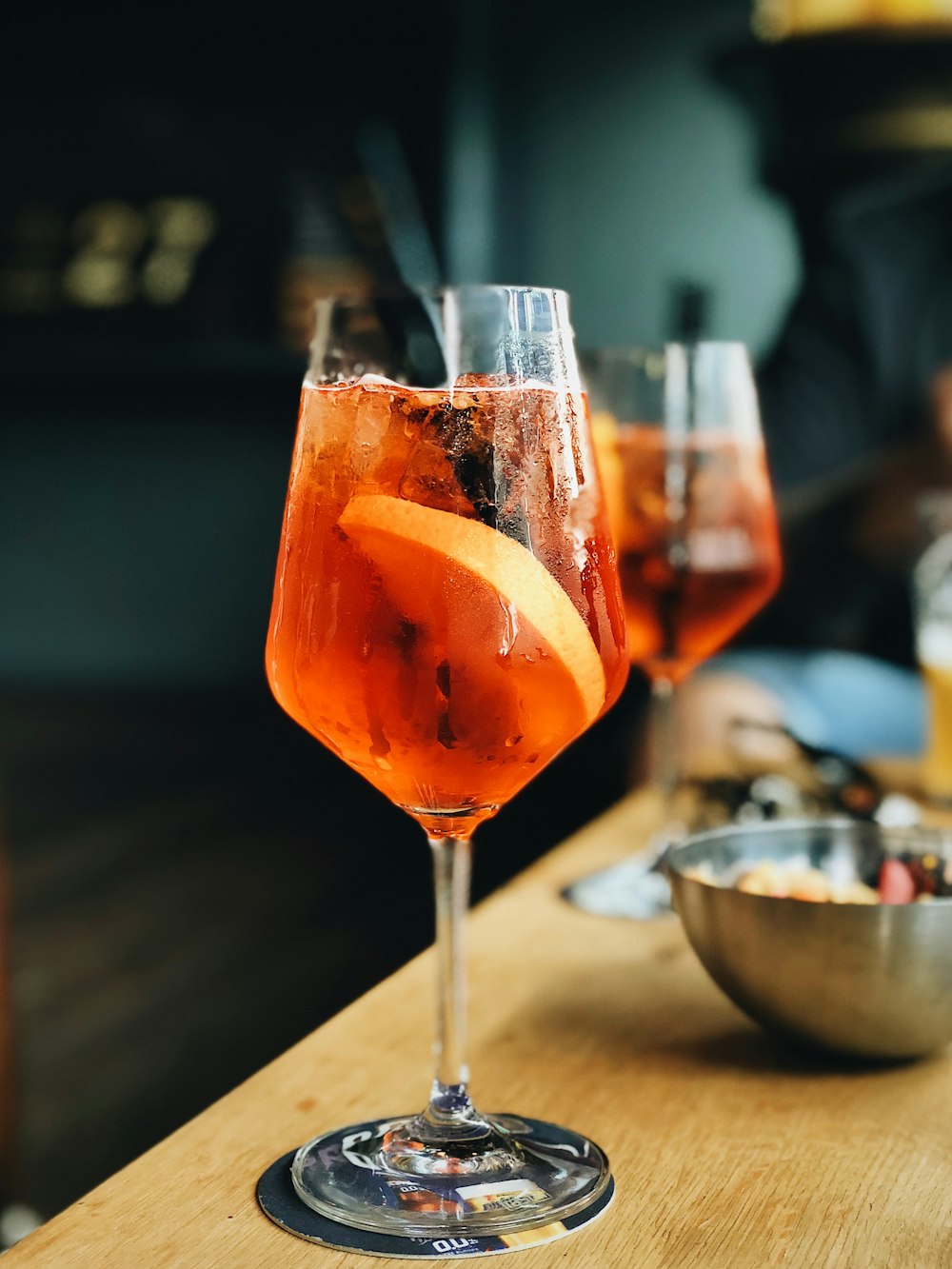 juice in glass with sliced lemon on table