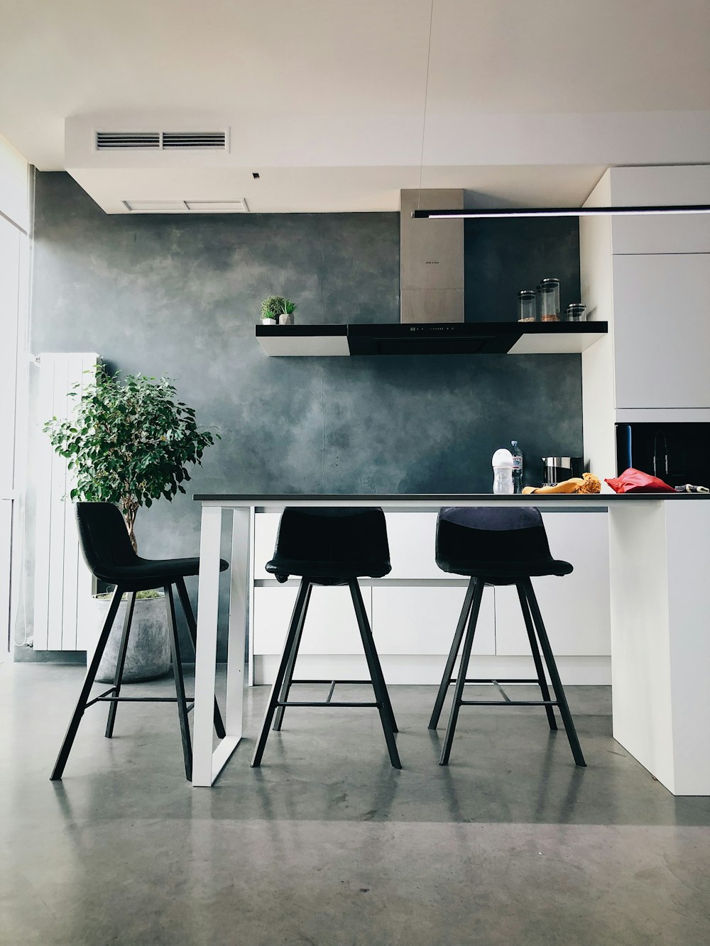 three black stools in kitchen