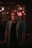man standing beside table