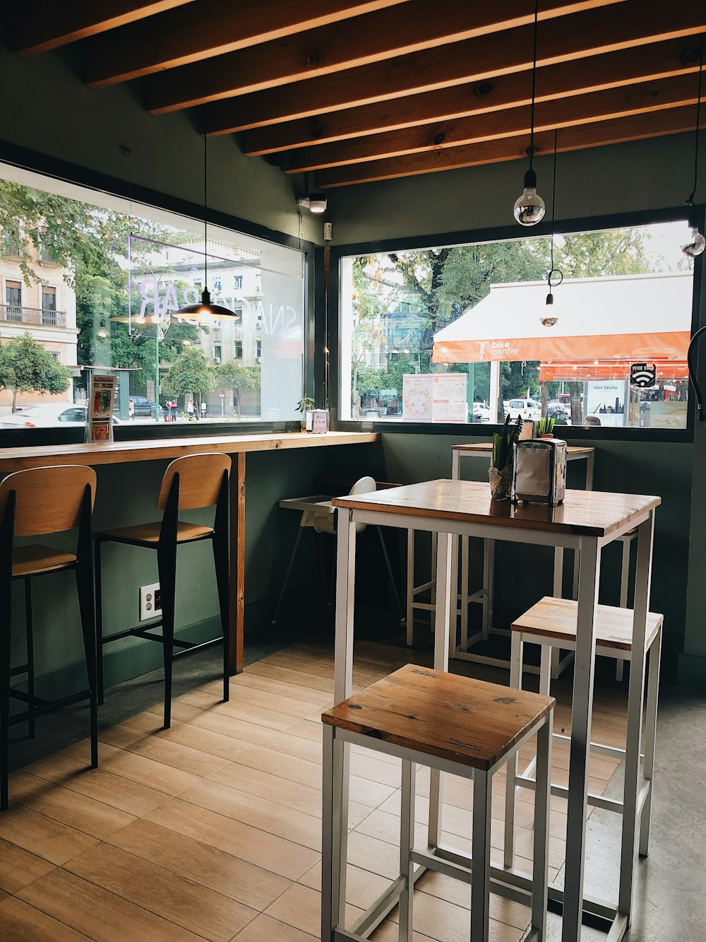 brown wooden table and chairs inside building