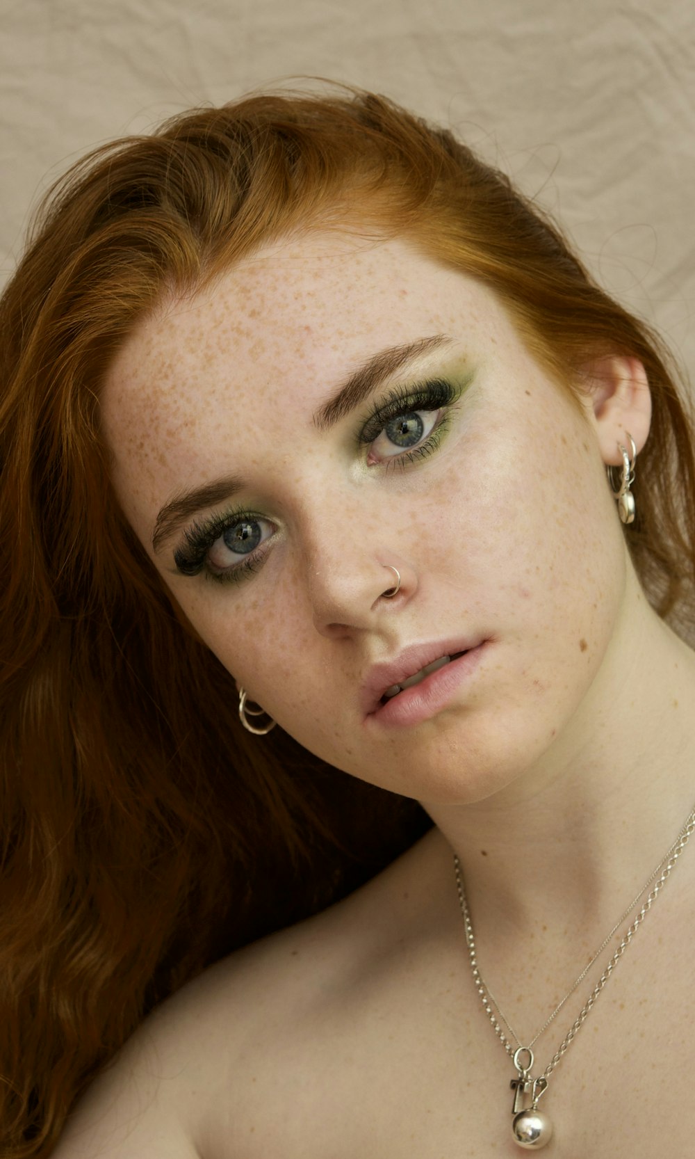 woman wearing silver-colored necklace