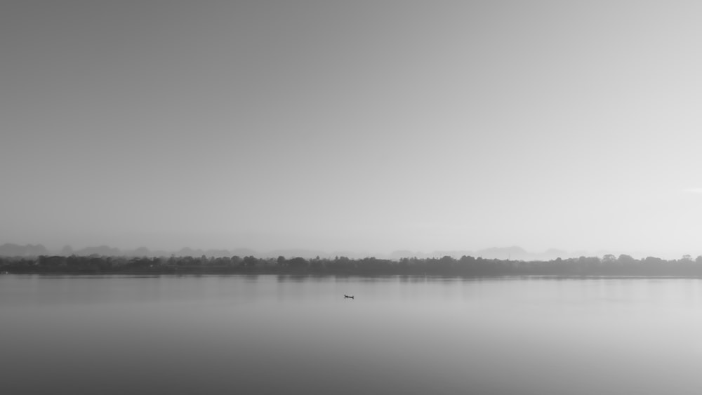 landscape photography of islet and ocean water